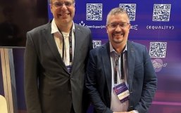 Frank Wilhelm-Mauch (OpenSuperQPlus coordinator) and Thomas Monz (coordinator of MILLENION) at the Quantum Flagship booth