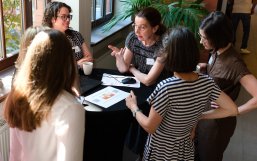 Team members engaged in a lively discussion about ongoing projects. Team members engaged in a lively discussion about ongoing projects.